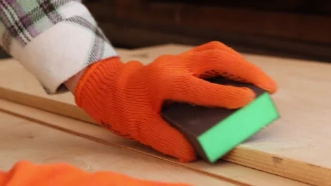The process of sanding a wooden surface with a sanding block 스톡 동영상 335475545