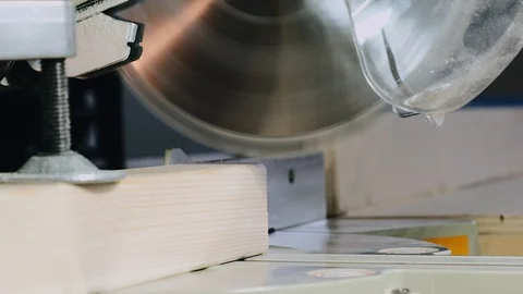 The process of sawing a bar with a circular saw. Close-up. Slow motion. Stock Footage 113993725