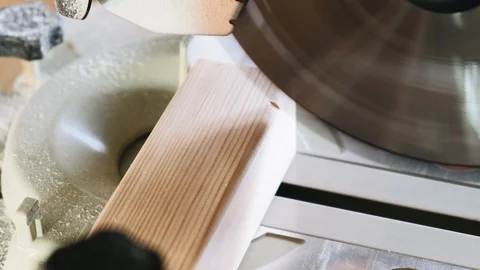 The process of sawing a bar with a circular saw. Close-up. Slow motion. Stock Footage 113993760