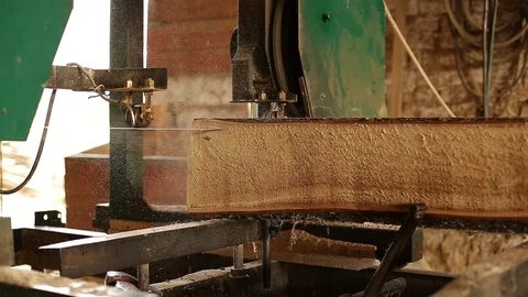 The process of sawing logs at the sawmill. Stock Footage 129081542