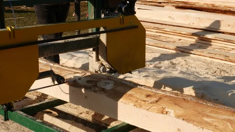 The process of sawing logs at the sawmill. Sawing logs on the board. Stock Footage 120054069