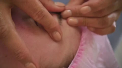 The process of sculpted facial massage in the cosmetologist’s office Stock Footage 130645053