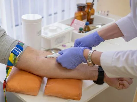 The process of selecting or taking venous blood with a disposable syringe fro Stock Photos