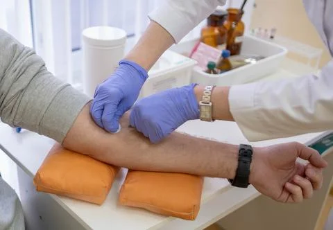 The process of selecting or taking venous blood with a disposable syringe fro Stock Photos