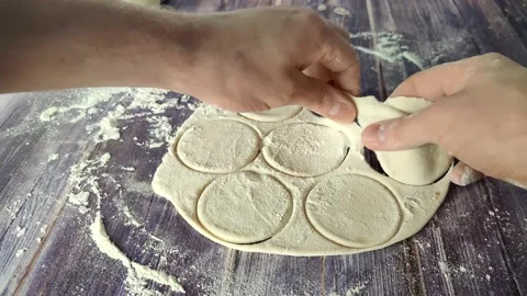 The process of separating circles from dough Stock Footage 232219174
