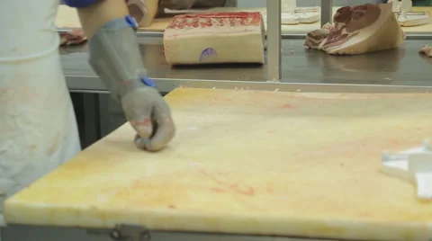 Process of separating meat from bone as a butcher close-up Stock Footage 63996157