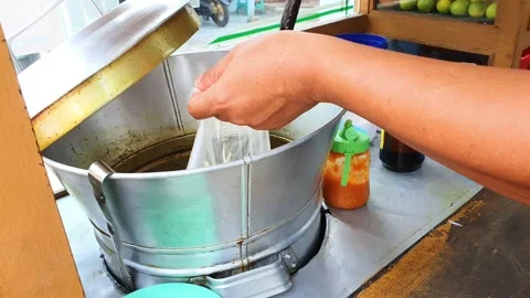 The process of serving Chicken Soto. Typical soup type food from Lamongan Stock Footage 213067643