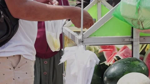 The process of serving rujak(fruit salad) by the seller to the buyer. Stock Footage 210373593
