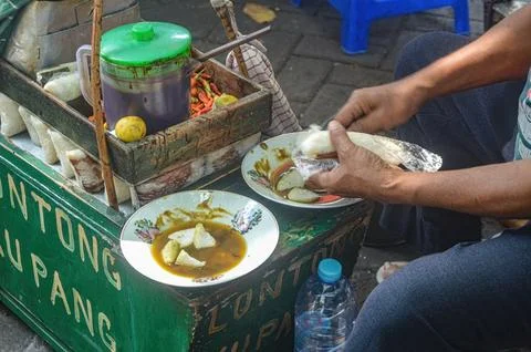 The process of serving a typical Sidoarjo food called Lontong Kupang, Trans.. Stock Photos