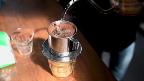 The process of serving Vietnamese drip coffee Stock Footage 230350559