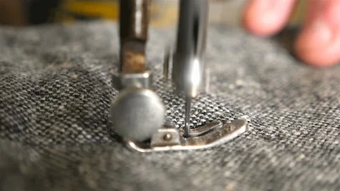 The process of sewing clothes on a sewing machine. Close-up of needle for sewing Stock Footage 88987427