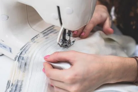 Process of sewing the curtains at home, close up of curtain tape on the sewin Stock Photos