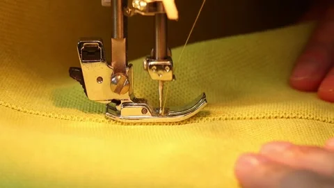 The process of sewing fabric on a sewing machine, The sewing machine needle Stock Footage 283446341