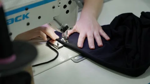 Process of sewing on sewing machine. Concept of folding clothes Stock Footage 279686035