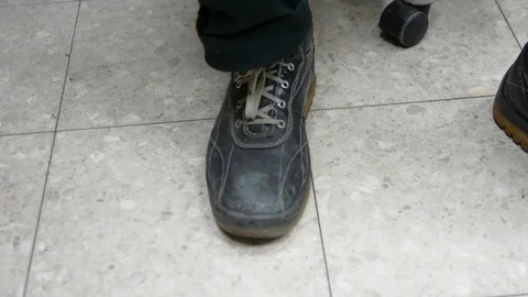 Process of shoes cleaning. Hand, brush and boot close up. mans hands brushing bl Stock-Footage 99766678