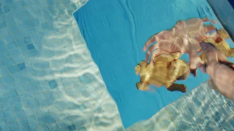 Process of shooting little baby doll underwater in studio Stock Footage 238932301