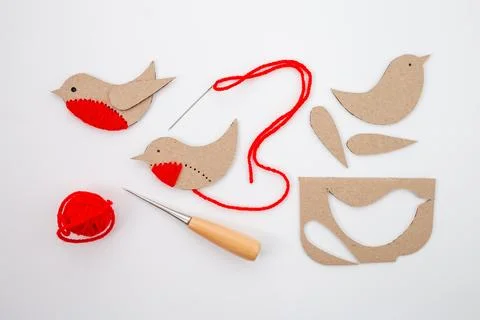 Process showing the creation of bird craft, detailing steps from cut-out pieces Stock Photos