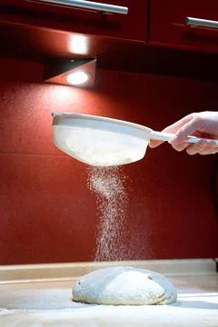The process of sifting flour into dough Stock Photos