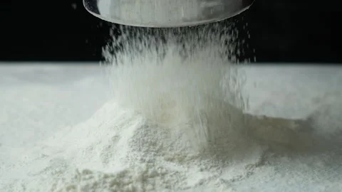 The process of sifting wheat flour through a metal sieve, slow motion Video stock 288196732