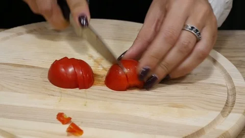 Process of slicing cherry tomatoes in slow motion Stock Footage 101545982