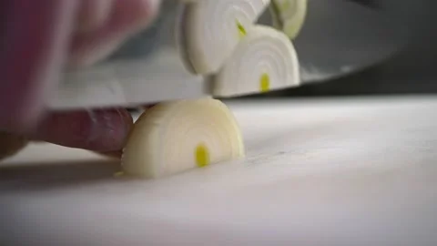 Process of slicing an onion with a large knife. Stock-Footage 150977243