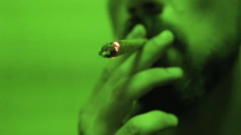 Process of smoking a close-up joint with marijuana  Stock Footage