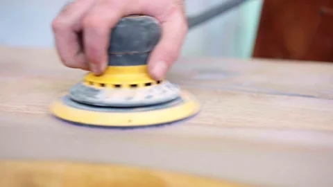 Process of smoothing wooden tabletop surface with electrical grinder machine Stock-Footage 263056561