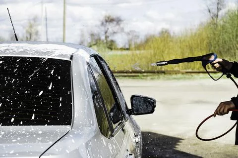 Process of soaping the car with a high-pressure Stock Photos