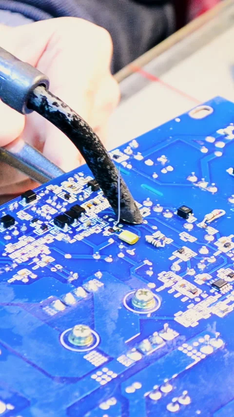 The process of soldering the chip, engineering work. Shot. Close up of male Stock Footage 306511743