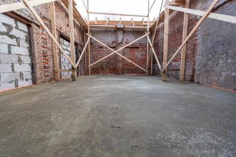 Process of solidification of concrete floor after pouring and reinforcement of Stock Photos