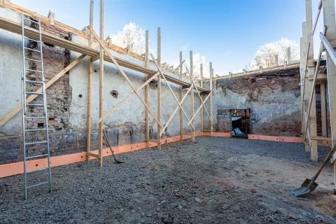 Process of solidification of concrete floor before pouring and reinforcement of Stock Photos