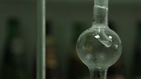 The process of solution boiling in a flask in a chemical laboratory. Stock Footage 102600179