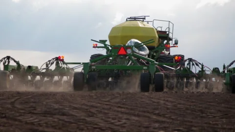 Process of sowing fields with grain crops using special large equipment. Stock Footage 146039141