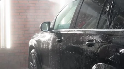 Process of spraying foam on the auto body in the station. Stock Footage 328982669