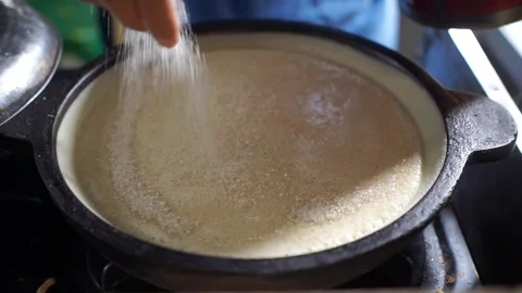 This process of sprinkling white sugar is what makes the martabak sweet Video stock 322125231
