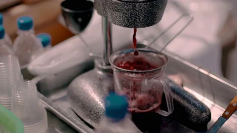 The process of squeezing the juice from the pomegranate fruit Stock Footage 151028139