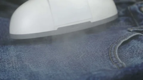 Process of steaming of jeans fabric using steamer Stock-Footage 71507410