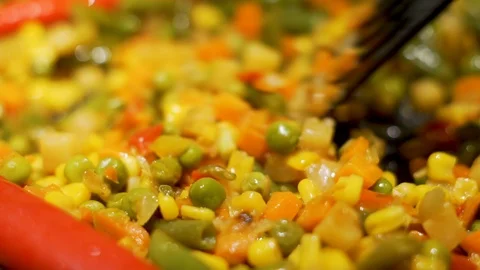 The Process of Stewing Delicious Colorful Vegetables for the Filling of a Mexica Stock Footage 125322980