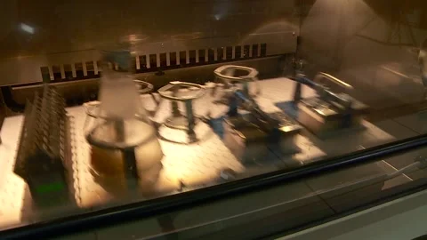 The process of stirring the contents in test tubes on a special apparatus in Stock Footage 296959140