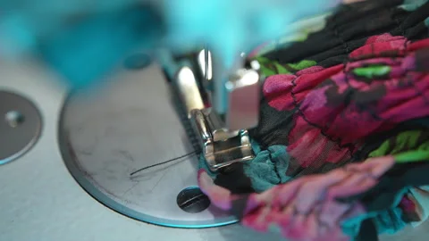 Process of stitching colourful textile fabric with professional sewing machine Stock Footage 246965456