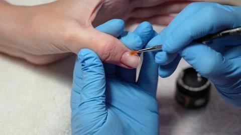 Process of strengthening and correction of natural nails with gel material Stock Footage 169579222