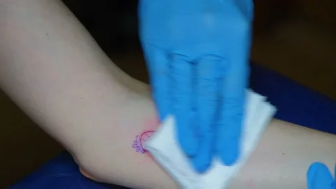 The process of stuffing a tattoo close-up. Hand poke tattoo close-up. Stuffing a Video stock 218463493