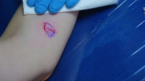 The process of stuffing a tattoo close-up. Hand poke tattoo close-up. Stuffing a Stock Footage 231495561