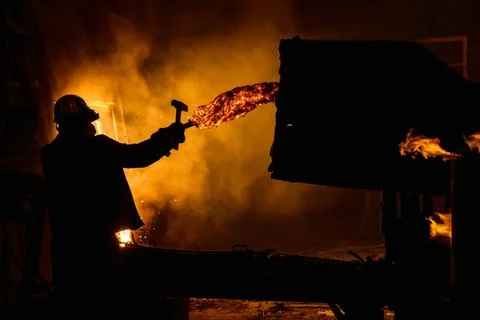 Process of taking a sample of liquid metal in a steelmaking furnace Stock Photos