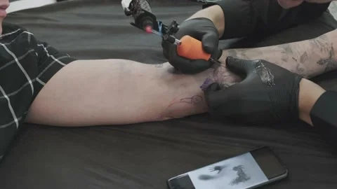 The process of tattooing the arm. Stock Footage 138428707