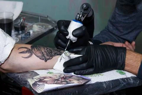 The process of tattooing on human skin Stock Photos