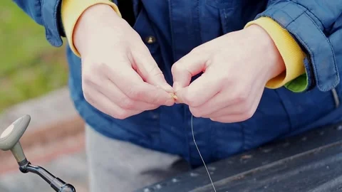 The process of threading a worm on a hook. Stock Footage 194897173