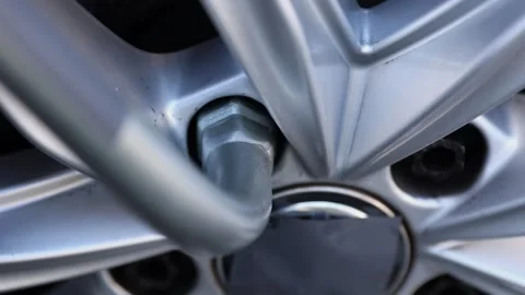 Process of tightening nuts during installation of wheel at service center Stock-Footage 322127285