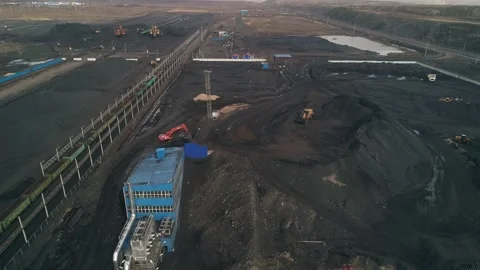 Process of transferring hard coal from trucks to rail cars for further Stock Footage 203919046