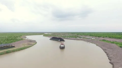 The process of transporting coal by ship. Borneo, Indonesia. Stock Footage 143594088